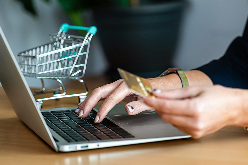 close-up-of-a-woman-hands-buying-online-with-a-cre-6KMZW7V